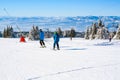 Ski slope, people skiing, mountains view