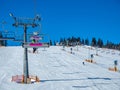 Ski slope with ski lifts and snow cannons Royalty Free Stock Photo