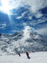 Ski slope, skiers ,ski resort, Eastern Pyrenees, Andorra sunny panoramic view, mountain background