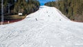 Ski slope with skiers, snowboarders and chairlift in Poland Royalty Free Stock Photo