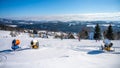 Ski slope with snow cannons in rural mountain area