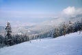 Ski slope and winter mountains panorama