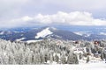 ski slope,wooden village rural house,hotels covered in snow in winter forest in mountains,nature Royalty Free Stock Photo