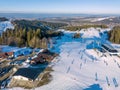 Ski slopes with skiers, snowboarders and chairlift in Poland Royalty Free Stock Photo