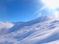 Ski snow slope and blue sky with sun