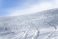 Ski and snowboard tracks on a slope