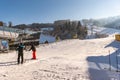 Waiting man near ski station Hauser Kaibling - one of Austria`s top ski resorts: 44 ski lifts, 123 kilometres of ski runs