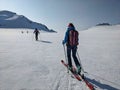 Ski touring group on the ascent to the summit on skis. On the glacier with a view of the Sustenhorn in the Bern Oberland