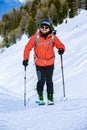 Ski touring man reaching the top at sunrise. Royalty Free Stock Photo