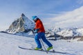 Ski touring man reaching the top in Swiss Alps. Royalty Free Stock Photo