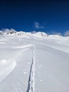 Ski touring track through the deep snow in a beautiful lonely mountain landscape. Sentisch Horn. Skimo Davos Switzerland