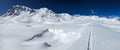 Ski touring track through the deep snow in a beautiful lonely mountain landscape. Sentisch Horn. Skimo Davos Switzerland