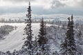 Ski track on mountain top overlooking the valley. Royalty Free Stock Photo