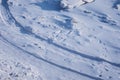 Ski track on the snow-covered ice of the river. Fragments of ice. Footprints after a snowfall. Glitter of snowflakes and