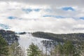 Ski trackway called black top on Divcibare mountain with cloudy sky