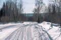 Ski trail in the forest. Traasa in the winter forest. The road for walking through the winter forest. Taiga in the winter. Tracks Royalty Free Stock Photo