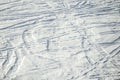 Ski trails and tracks texture in fresh snow. Sunny day. Background with copy space for text. Royalty Free Stock Photo