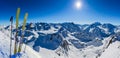 Ski in winter season, mountains and ski touring backcountry equipments on the top of snowy mountains in sunny day, Verbier