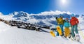 Ski in winter season, mountains and ski touring equipments on the top in sunny day in France, Alps above the clouds Royalty Free Stock Photo