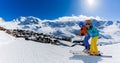 Ski in winter season, mountains and ski touring equipments on the top in sunny day in France, Alps above the clouds Royalty Free Stock Photo