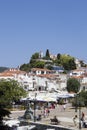 Agios Nikolaos Church and Clock Tower above harbour with Alexander Papadiamantis statue below