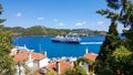 Skiathos, Greece - August 2023: Ferryboat approaching harbour at city of Skiathos at Skiathos island