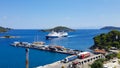 Skiathos, Greece - August 2023: Ferryboat approaching harbour at city of Skiathos at Skiathos island