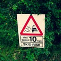 Skid risk warning sign on a country road