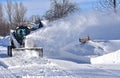 Skid steer blowing snow Royalty Free Stock Photo