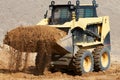 Skid steer loader at earth moving works