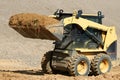Skid steer loader at earth moving works Royalty Free Stock Photo