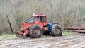 A skidder with chains