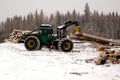 Skidder hauling spruce tree Royalty Free Stock Photo