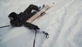 Skier after accident waiting for rescue lying in snow. Clip. Professional skier after crash accident on skiing resort