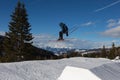 Skier in Action: Ski Jumping in the Mountain Snowpark Royalty Free Stock Photo