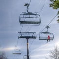 Skier alone on a ski lift at a ski resort in Utah