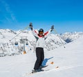 Skier on the background of high snow-capped Alps in sun day Royalty Free Stock Photo