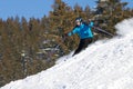Skier carving in deep powder snow