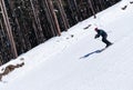 Skier carving down from steep slope Royalty Free Stock Photo