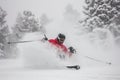 skier descending a snowcovered slope in flurry