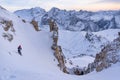 Skier dropping down in Joel couloir with the sunset and Marmolada range in front Royalty Free Stock Photo