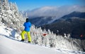 Skier enjoying the view from the peak of the mountain. Royalty Free Stock Photo