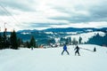 The skier in the equipment rises to the mountain on a lift in the Ukrainian Carpathians