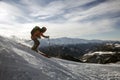 Skier freerides at the backlit resort, Tetnuldi, the Greater Caucasus Mountain Range, Upper Svaneti, Georgia, Europe