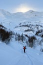 Skier freerides at the backlit resort, Tetnuldi, the Greater Caucasus Mountain Range, Upper Svaneti, Georgia, Europe