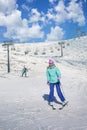 Skier girl on a ski resort