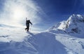 Skier Hiking To Mountain Summit