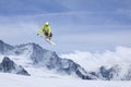 Skier jump in the mountains. Extreme ski sport. Freeride.