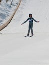 Ski jumper at landing after his jump Royalty Free Stock Photo
