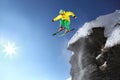 Skier jumping against blue sky